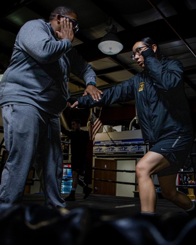 Pvt. Guadalupe Gutierrez, a boxer assigned to the U.S. Army World Class Athlete Program receives training from Boxing Technical Advisor Charles Leverette during training in Colorado Springs, Colorado, April 5, 2022. Gutierrez recently joined the World Class Athlete Program and is preparing for competitions. (U.S. Army Photo by Sgt. Michael Hunnisett)