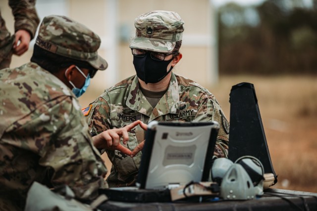 Staff Sgt. Erica Myers, an Operations Advisor with 5th Security Force Assistance Brigade, mentors a Soldier from 1-2 Stryker Brigade Combat Team, Nov. 10, 2020 during Joint Readiness Training Center Rotation 21-2 at Fort Polk, Louisiana. The...