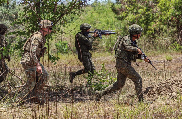 U.S. Soldiers assigned Delta Company, 2nd Battalion, 27th Infantry Regiment, 3rd Infantry Brigade Combat Team, 25th Infantry Division, observe Philippine Army soldiers, assigned to the Philippine Army 7th Infantry Division, as they rapidly engage...