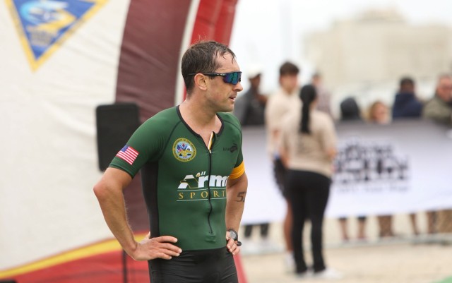 Maj. Nicholas Sterghos, a member of the Army Reserve, catches his breath after finishing 4th in the 2024 Armed Forces Triathlon Championship on July 29 at Point Mugu Beach, Calif.