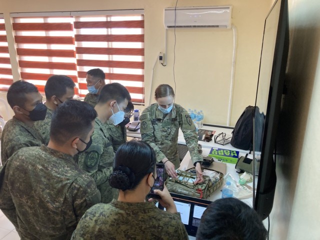 The 5th Security Force Assistance Brigade Nurse, Maj. Kelly Spencer demonstrates medical aid bag packing for members of the Philippine Army at Fort Magsaysay, Philippines, Mar. 14, 2022. This portion of the bilateral training between 5th SFAB...