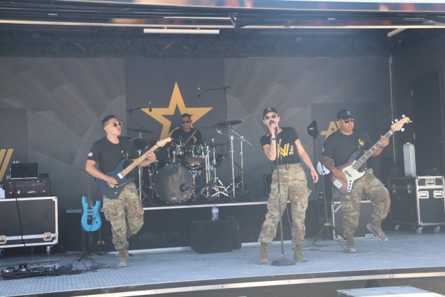 The Army’s ‘As You Were’ Band takes stage at the Miami Air and Sea Show on May 26. The band performed multiple sets during the show, entertaining the crowds in attendance. From left to right are Sgt. Arthur Abila, lead guitarist, lead...