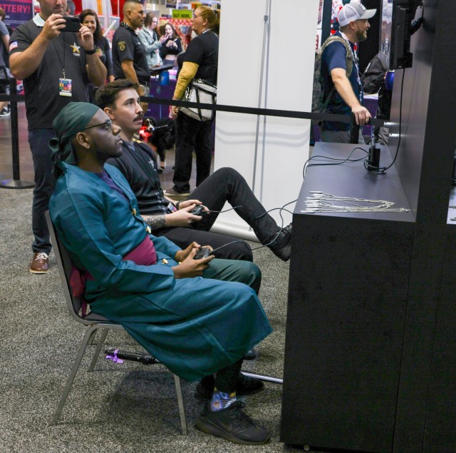 ORLANDO, Fla. – Staff Sgt. Hunter Sanborn (center left), a fire support specialist currently assigned to U.S. Army Esports, Recruiting Outreach Company, U.S. Army Accessions Mission Support Battalion competes against guests of MegaCon Orlando...