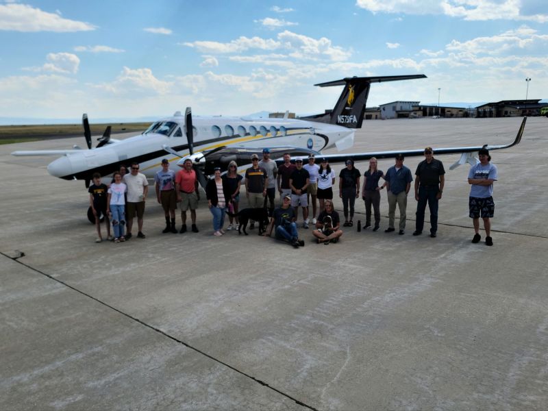 University of Wyoming King Air Research Aircraft, on the ground with group of people