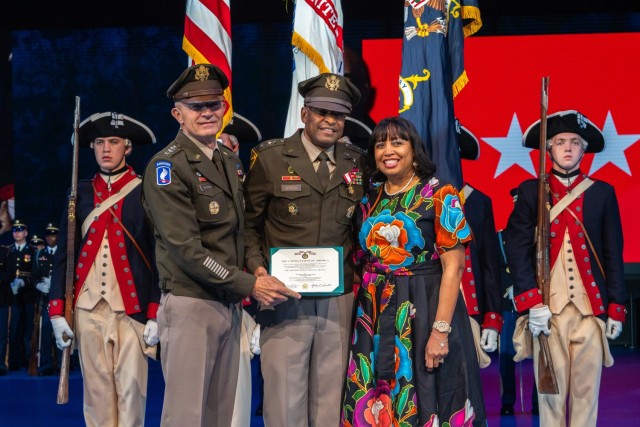 Lt. Gen. Kevin Vereen, center, and his wife, Monica are honored by Army Chief of Staff Gen. Randy A. George, left during Vereen's retirement ceremony at Joint Base Myer-Henderson Hall Aug. 28, 2024.