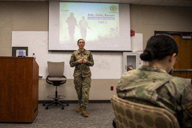 Maj. Jennifer Nevers, a behavioral health officer with the Indiana Army National Guard, introduces instructors from the Walter Reed Institute of Research prior to a two-day long suicide prevention pilot program at Johnson County Armory, Indiana on...