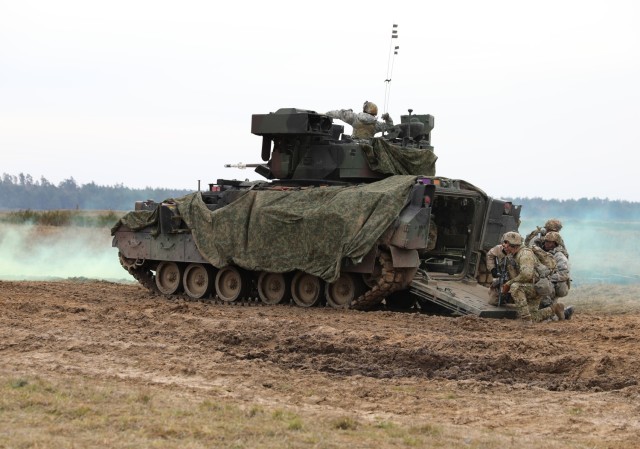 U.S. Army Soldiers assigned to 3rd Battalion, 15th Infantry Regiment, 2nd Armored Brigade Combat Team, 3rd Infantry Division dismount an M2A4 Bradley Fighting Vehicle while participating in Dragon 24, a NATO training event, held at Bemowo Piskie...