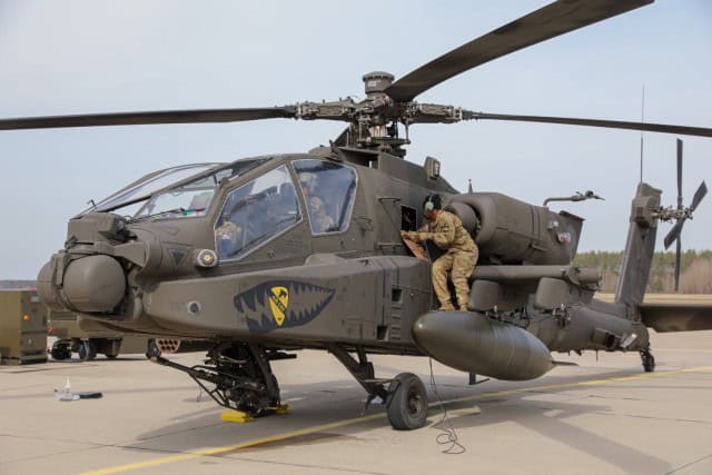 U.S. Army Staff Sgt. Eric Hawkins, armament, electrical, aviation systems repairer assigned to 7th Squadron, 17th Cavalry Regiment, 1st Air Cavalry Brigade, 1st Cavalry Division, verifies repairs on an AH-64E Apache Guardian attack helicopter at a...