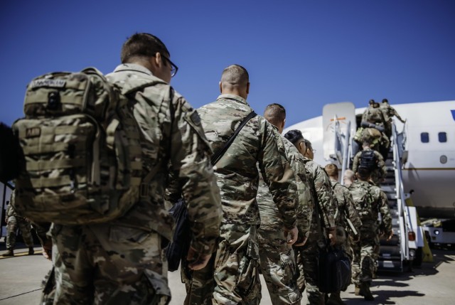 Citizen-Soldiers with 1st Battalion, 179 Infantry Regiment, Oklahoma Army National Guard prepare to board a charter flight in Oklahoma City, April 17, 2023. Soldiers on approved operational deployments will receive $240 per month under the...