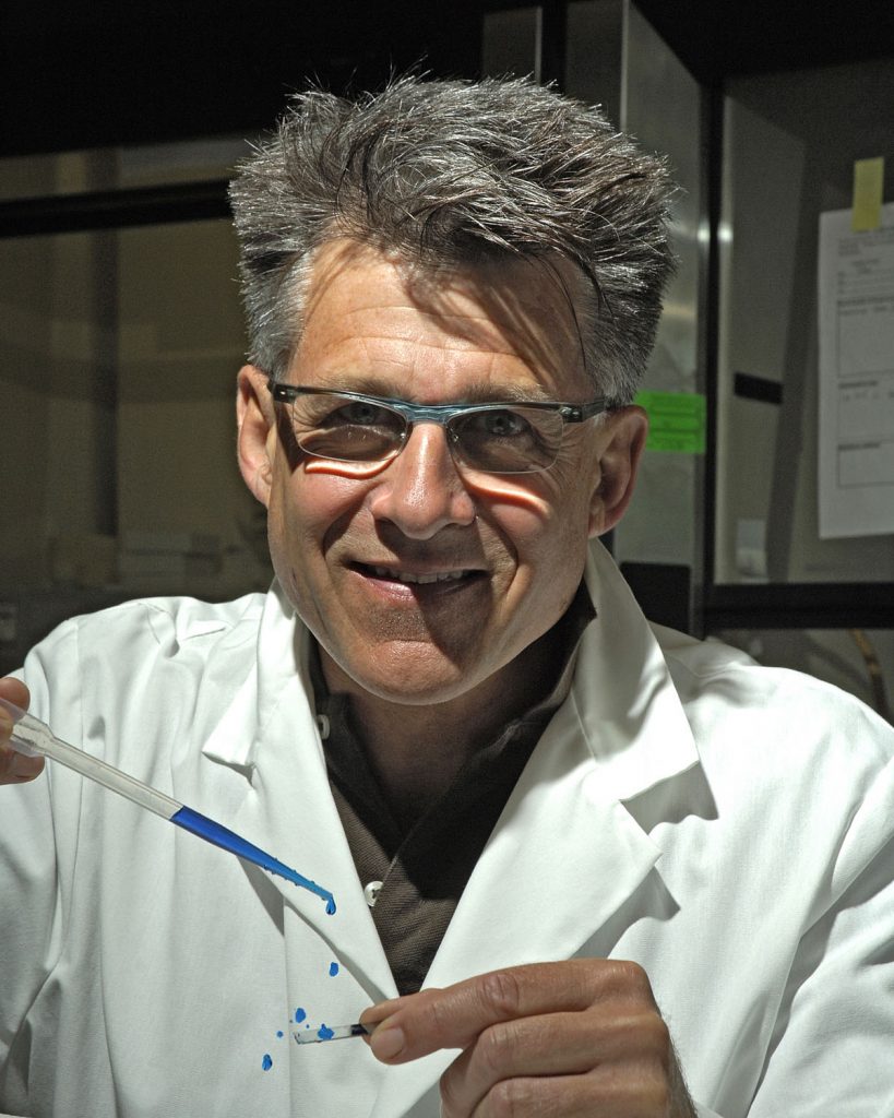 Sandia researcher Jeff Brinker bounces water droplets as though they were marbles off a superhydrophobic surface. Such surfaces do not absorb water but instead, actively repel it.