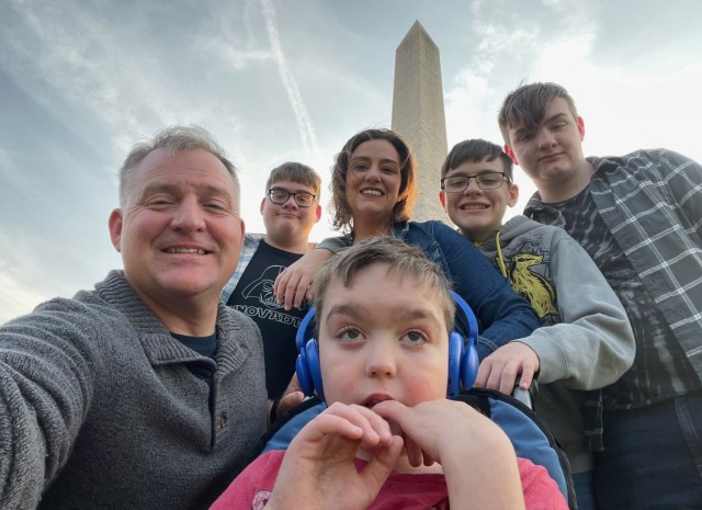 Lt. Col. Tony Messenger, 3rd Squadron commander, Second Security Forces Assistance Brigade, Fort Liberty, North Carolina, his son, Connor, 18, wife, Amy, Liam, 16, Colin, 14, and Keegan (center), 12, stop for a quick selfie during a visit to...