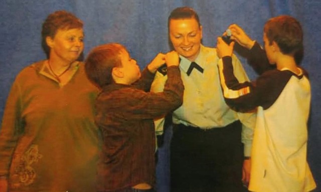 Melissa O'Brien celebrates her promotion to master sergeant in2007 with her mother and two sons. She promoted during her assignment to England, where she helped stand-up U.S. Africa Command.