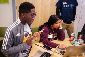 O.J. Ukpedinjagba, left, worked with teammate Sowmya Sankaran to solve a problem during the 2024 Thunderbird Hacks event, sponsored by Sandia National Laboratories. (Photo by Craig Fritz) Click on the thumbnail for a high-resolution image.