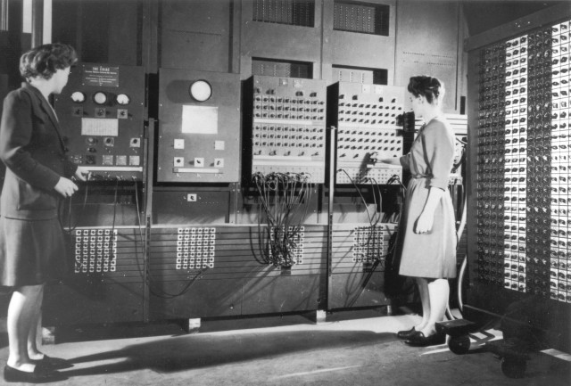 Programmers Betty Jean Jennings, left, and Fran Bilas, right, operate ENIAC's main control panel at the Moore School of Electrical Engineering, circa 1945.